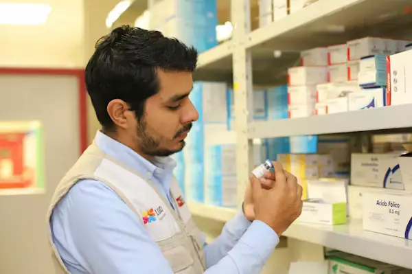 Pharmacy Technician preparing and dispensing medication